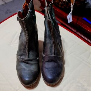 Leather booties with wooden wedge heel.